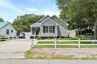 157 NE 3rd Street, Oak Island, NC 28465 — 2-bedroom home in Tranquil Harbor, Oak Island, NC, photo 1 of 74