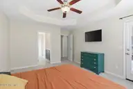 404 Hidden Oaks Drive, Jacksonville, NC 28546 — 3-bedroom home in Hunters Creek, Jacksonville, NC, photo 16 of 28: Cozy bedroom with modern accents