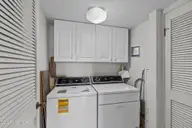 590 Marina Drive E-5, Pine Knoll Shores, NC 28512 — 3-bedroom waterfront condo in Beacon's Reach, Pine Knoll Shores, NC, photo 19 of 31: Laundry room