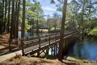 9290 100 Cargill Drive, Calabash, NC 28467 — lot in Devaun Park, Calabash, NC, photo 11 of 43: bridge to pool 2