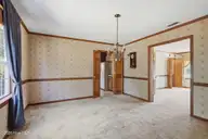 2604 One Iron Street, Morehead City, NC 28557 — 4-bedroom home in Country Club East, Morehead City, NC, photo 13 of 40: Formal dining to living