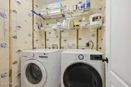 402 Penny Lane D, Morehead City, NC 28557 — 3-bedroom condo in Madisen Park, Morehead City, NC, photo 17 of 46: Laundry Room w/ Shelving