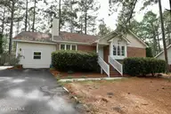 100 Sawmill Road E, Pinehurst, NC 28374 — 3-bedroom home in Village Acres, Pinehurst, NC, photo 1 of 25