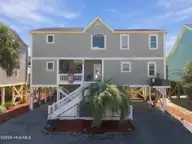 134 Ocean Boulevard E, Holden Beach, NC 28462 — 4-bedroom waterfront home in Holden Beach, Holden Beach, NC, photo 1 of 48: 2-web-or-mls-DJI_20261014131215_0897_D