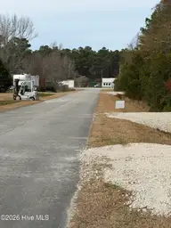 0 1 Joans Haven Drive, Newport, NC 28570 — lot in Joan's Haven, Newport, NC, photo 8 of 8: wooded lot street 2
