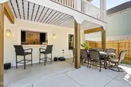 111 SW 22nd Street, Oak Island, NC 28465 — 4-bedroom home in Pinners Point, Oak Island, NC, photo 10 of 73: bar pass through