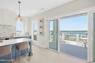 1014 N Anderson Boulevard, Topsail Beach, NC 28445 — 5-bedroom waterfront home, Topsail Beach, NC, photo 17 of 66: Double Sliders Top Deck Soundside