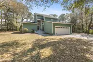 909 Cobia Lane, Wilmington, NC 28409 — 4-bedroom waterfront home in Dolphin Bay, Wilmington, NC, photo 2 of 60: Front of House