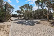 104 Lot 7 7 Roosevelt Reserve Park Place, Pine Knoll Shores, NC 28512 — waterfront lot in Roosevelt Reserve, Pine Knoll Shores, NC, photo 5 of 11: Charming Paver Roadway