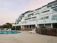 351 Salter Path Road 402, Pine Knoll Shores, NC 28512 — 3-bedroom waterfront condo in Bogue Shore Club, Pine Knoll Shores, NC, photo 6 of 15: View of Condos from Pool