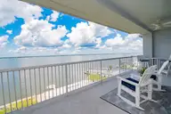 1550 Salter Path Road 606, Indian Beach, NC 28512 — 3-bedroom waterfront condo in The Nautical Club, Indian Beach, NC, photo 14 of 45: Covered Porch