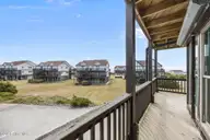 102 Diann Drive A2, Emerald Isle, NC 28594 — 2-bedroom condo in Ocean Reef, Emerald Isle, NC, photo 23 of 40: Wrap Around Porch Off Primary Bedroom