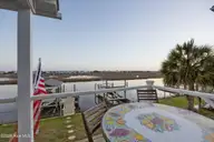 103 E Island Drive, Oak Island, NC 28465 — 3-bedroom waterfront home, Oak Island, NC, photo 9 of 76: 115_twilight