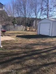 3923 Sabre Lane, Wilson, NC 27896 — 3-bedroom home in Jetstream Park, Wilson, NC, photo 5 of 18: BACK YARD WITH STORAGE BUILDING