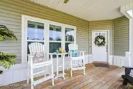 202 NE 64th Street, Oak Island, NC 28465 — 3-bedroom home, Oak Island, NC, photo 5 of 49: Smell the ocean air from your porch