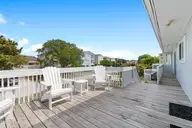 402 Dolphin Street, Sunset Beach, NC 28468 — 3-bedroom waterfront home, Sunset Beach, NC, photo 14 of 53: Open Deck off main entrance