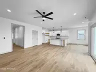 321 Yawl Street, Elizabeth City, NC 27909 — 5-bedroom home in Tooley Harbor, Elizabeth City, NC, photo 13 of 29: Living Room to Kitchen