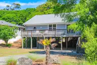 129 Indigo Drive, Emerald Isle, NC 28594 — 3-bedroom home in Bluewater Bay, Emerald Isle, NC, photo 2 of 29: Street View of Home