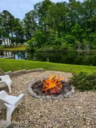 218 Lake Arthur Drive, Newport, NC 28570 — 3-bedroom waterfront home in Lake Arthur Estates, Newport, NC, photo 24 of 39: Fire pit