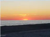 209 5 NE 69th Street, Oak Island, NC 28465 — lot in Tranquil Harbor, Oak Island, NC, photo 17 of 22: Oak Island Sunset