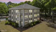 213 Kings Trail # 1004, Sunset Beach, NC 28468 — 2-bedroom condo in Sea Trail Plantation, Sunset Beach, NC, photo 2 of 52: 31_virtual twilight