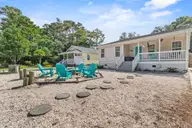 316 NE 52nd Street, Oak Island, NC 28465 — 3-bedroom home in Tranquil Harbor, Oak Island, NC, photo 1 of 49: 1_front exterior