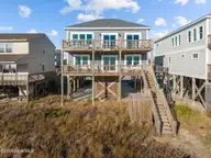 4321 E Beach Drive, Oak Island, NC 28465 — 6-bedroom waterfront home in E. Long Beach, Oak Island, NC, photo 1 of 49: 53-web-or-mls-DJI_20251231150938_0613_D