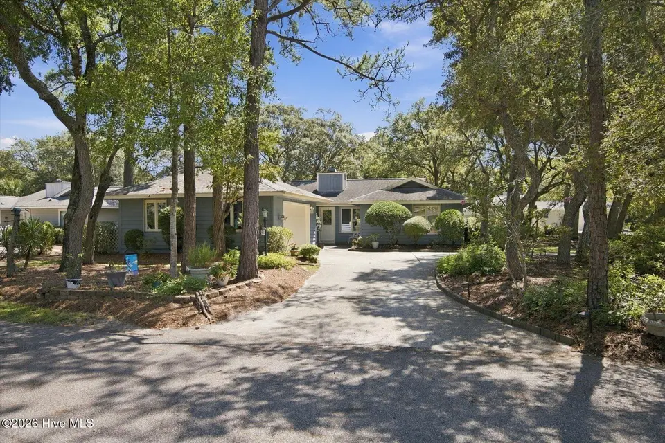 611 Camellia Lane, Sunset Beach, NC 28468 — 2-bedroom home in Sea Trail Plantation, Sunset Beach, NC, photo 1 of 55