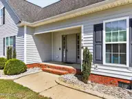 102 Clayside Drive, Pikeville, NC 27863 — 3-bedroom home in Planters Ridge, Pikeville, NC, photo 4 of 29: 003-1280x960-front-walk