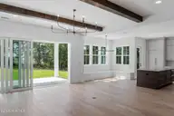 217 Paddle Court, Wilmington, NC 28412 — 3-bedroom home in Riverlights, Wilmington, NC, photo 8 of 25: Oak Hill Living to Dining and Porch