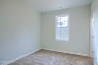 202 Broadleaf Drive, Jacksonville, NC 28546 — 4-bedroom waterfront home in Creekside at Aragona Village, Jacksonville, NC, photo 24 of 34: Third bedroom