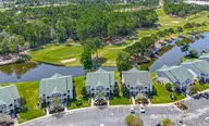 948 Great Egret Circle SW 28d, Sunset Beach, NC 28468 — 3-bedroom condo in Sandpiper Bay, Sunset Beach, NC, photo 3 of 36: dji_fly_20250906_132212_0073_17572962748