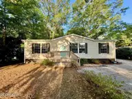 407 Maple Street SW, Shallotte, NC 28470 — 2-bedroom manufactured home in Lakewood Estates, Shallotte, NC, photo 2 of 26: front yard