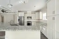 8983 Mango Bay Court NE, Leland, NC 28451 — 4-bedroom townhome in Compass Pointe, Leland, NC, photo 14 of 53: Ample Granite Countertops/Cabinetry