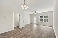 131 Beacon Woods Drive, Holly Ridge, NC 28445 — 2-bedroom townhome in The Townes At Holly Ridge, Holly Ridge, NC, photo 11 of 38: Living Room
