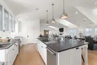585 Forest Dunes Drive, Pine Knoll Shores, NC 28512 — 4-bedroom waterfront home in Beacon's Reach, Pine Knoll Shores, NC, photo 17 of 68: Gourmet kitchen w/ oversized pantry