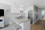 9201 Coast Guard Road A208, Emerald Isle, NC 28594 — 3-bedroom waterfront condo in Pebble Beach, Emerald Isle, NC, photo 11 of 45: Kitchen with granite countertops