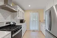 1321 Marsh Line Court SW, Shallotte, NC 28470 — 3-bedroom waterfront home in Marsh Cove, Shallotte, NC, photo 18 of 75: Ceramic Subway Tile Backsplash