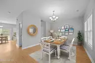 106 Bobwhite Circle, Cape Carteret, NC 28584 — 3-bedroom home in Quailwood Village, Cape Carteret, NC, photo 6 of 60: Virtually Staged Dining Room