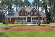 105 Saville Row, Pinehurst, NC 28374 — 4-bedroom home in Linden Close, Pinehurst, NC, photo 1 of 45: Natural Cedar siding