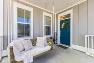 9096 Village Lake Drive SW, Calabash, NC 28467 — 5-bedroom home in Devaun Park, Calabash, NC, photo 5 of 46: Front Porch & Door
