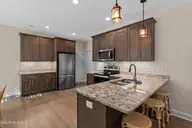 696 Folly Drive, Bolivia, NC 28422 — 3-bedroom home in River Run Plantation, Bolivia, NC, photo 12 of 47: 16_kitchen