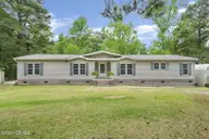 552 Colonial Landing Road SE, Bolivia, NC 28422 — 2-bedroom waterfront manufactured home in Vineyard Landing, Bolivia, NC, photo 1 of 52: 3-web-or-mls-Front ext close
