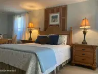 122 Ocean Boulevard E, Holden Beach, NC 28462 — 3-bedroom waterfront home, Holden Beach, NC, photo 20 of 39: Downstairs BR 3