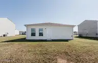 1225 Fescue Road, Rocky Mount, NC 27801 — 4-bedroom home in Flagmarsh Hills, Rocky Mount, NC, photo 11 of 13: Rear View