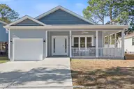 129 NW 8th Street, Oak Island, NC 28465 — 3-bedroom home in Tranquil Harbor, Oak Island, NC, photo 1 of 54: 129NW8thSt - 1