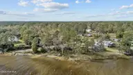 211 S River Drive, Beaufort, NC 28516 — waterfront lot in Sportsman Village, Beaufort, NC, photo 10 of 25: 9-web-or-mls-DJI_20241115131144_0978_D