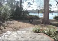 2856a Forest Hills Loop SW, Wilson, NC 27893 — 3-bedroom waterfront home, Wilson, NC, photo 16 of 58: 16 _ Lake View _ Stone Patio_Path