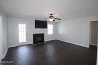 302 Paddock Place, Jacksonville, NC 28546 — 3-bedroom home in Horse Creek Farms, Jacksonville, NC, photo 2 of 16: living room