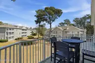 908 Resort Circle Unit 510, Sunset Beach, NC 28468 — 1-bedroom condo in Colony II, Sunset Beach, NC, photo 19 of 30: Picnic area view